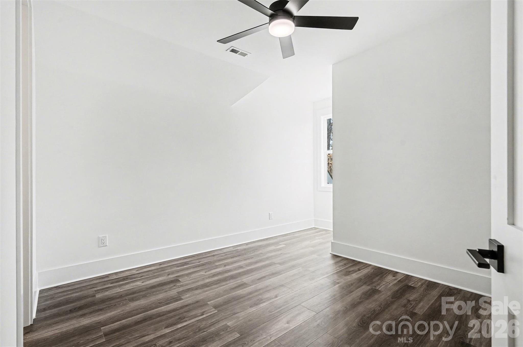 149 Shady Cove Road Troutman, NC 28166 - Photo 37 of 48 a view of a room with wooden floor