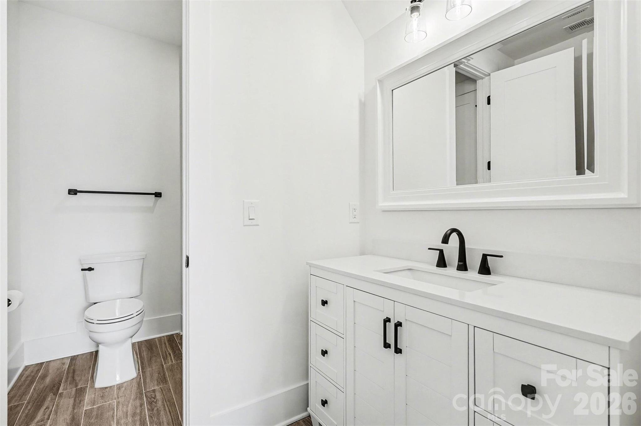 149 Shady Cove Road Troutman, NC 28166 - Photo 40 of 48 a bathroom with a sink and a toilet