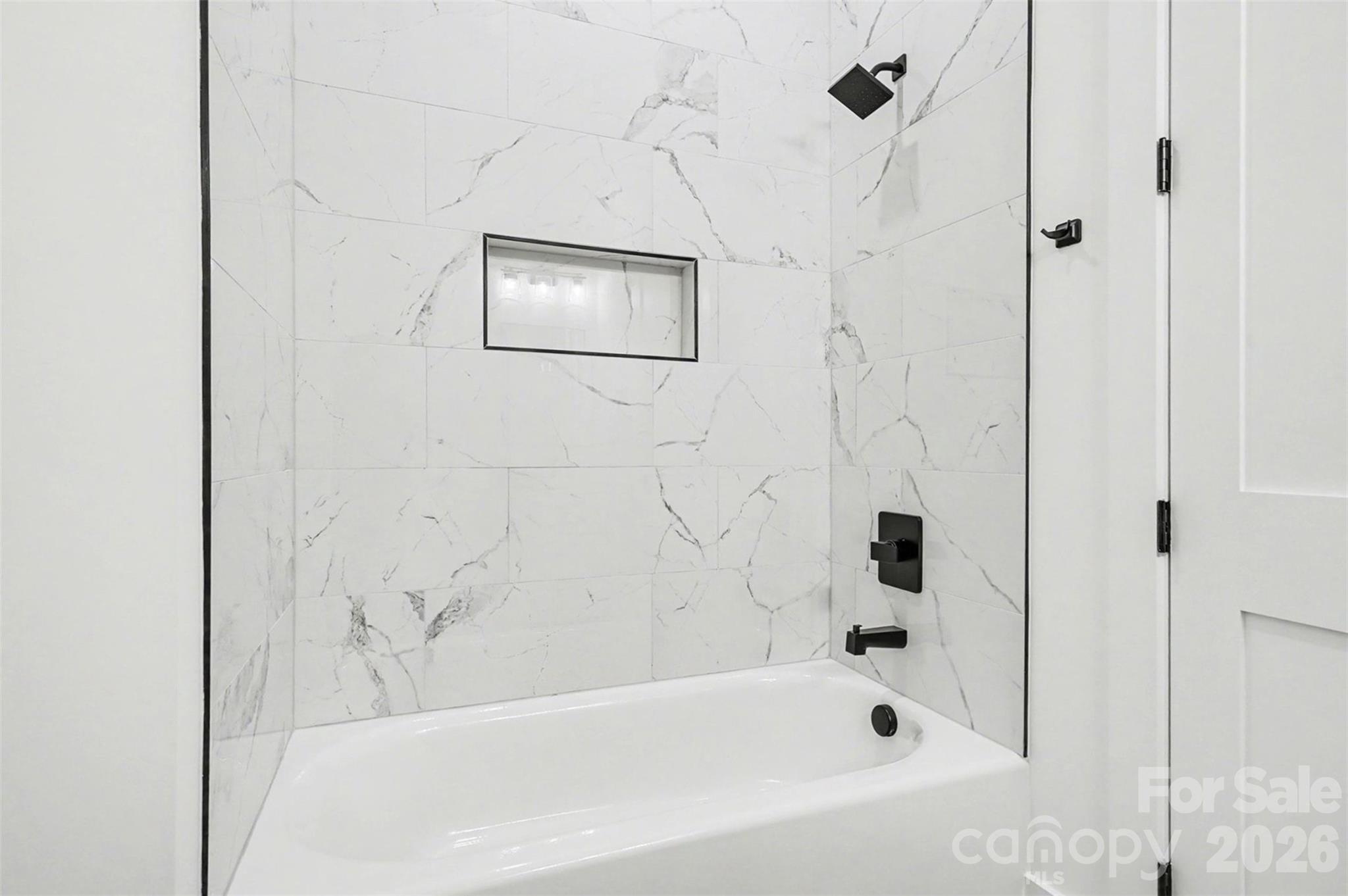 149 Shady Cove Road Troutman, NC 28166 - Photo 41 of 48 a bathroom with a bathtub and shower