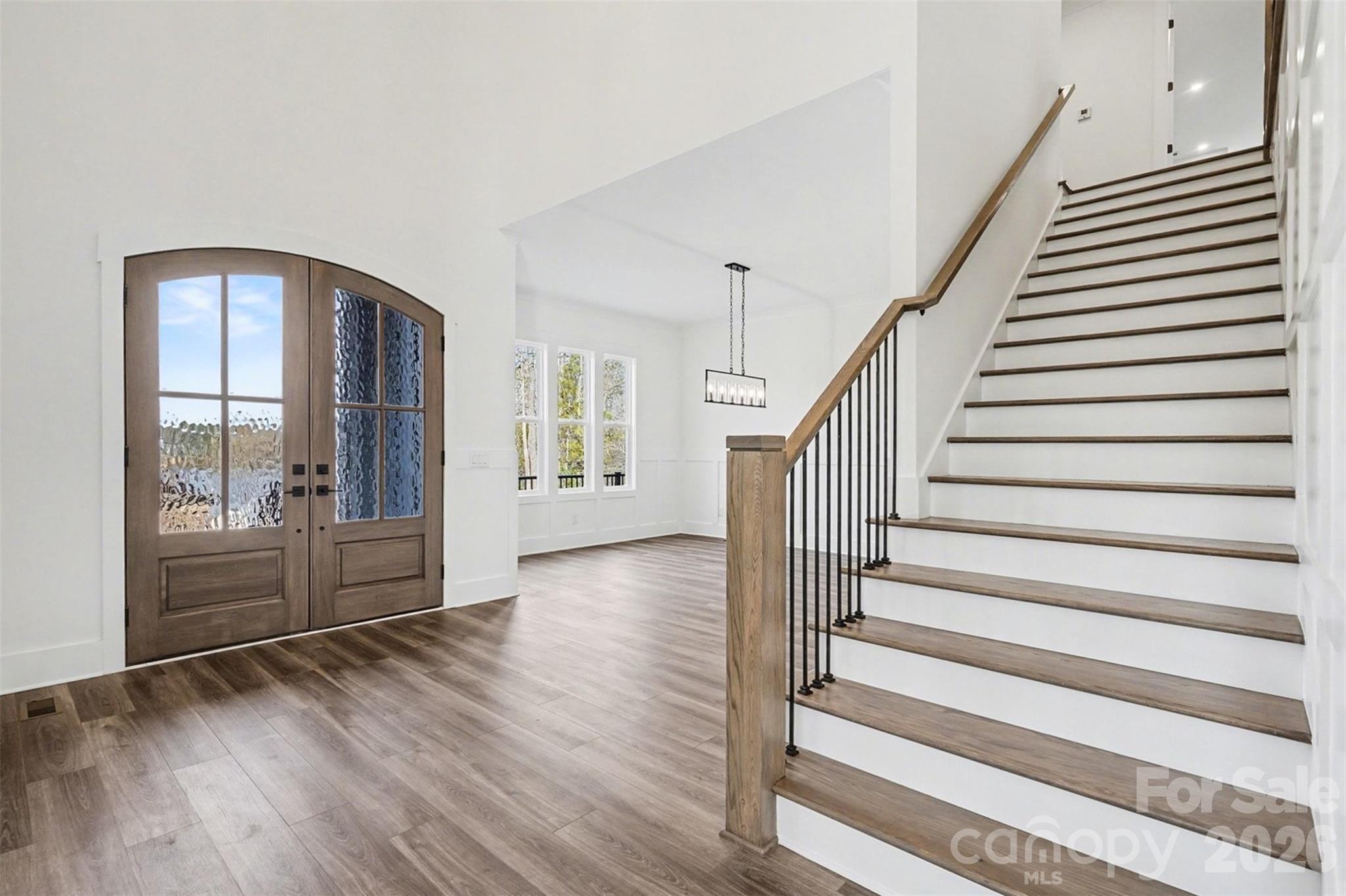 149 Shady Cove Road Troutman, NC 28166 - Photo 7 of 48 a view of entryway and hall with wooden floor