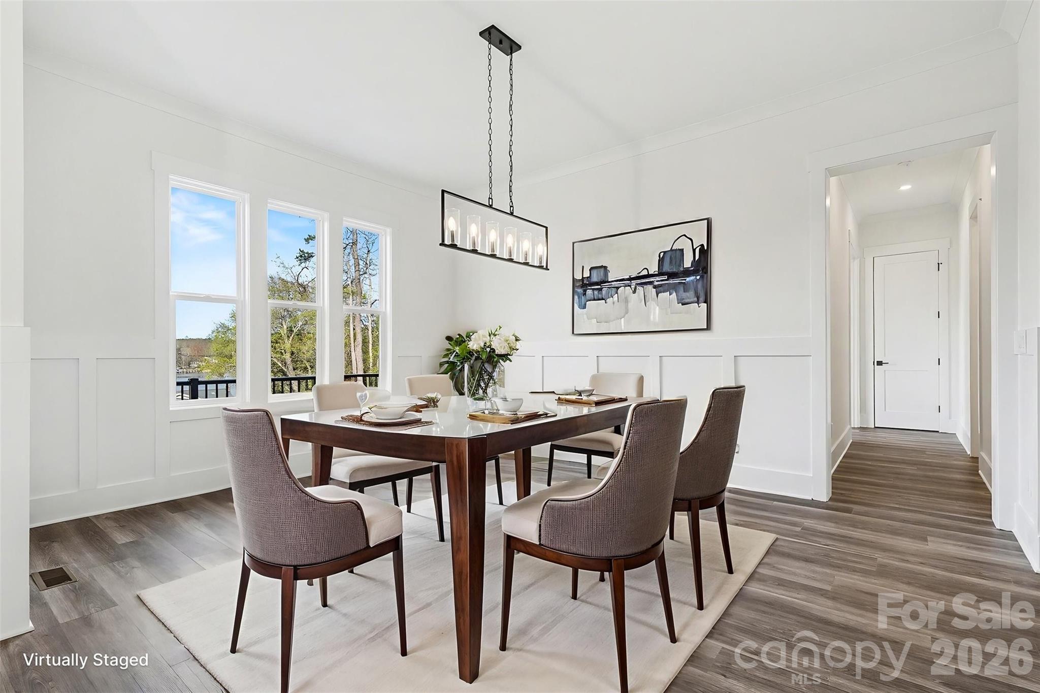 149 Shady Cove Road Troutman, NC 28166 - Photo 9 of 48 a view of a dining room with furniture window and wooden floor