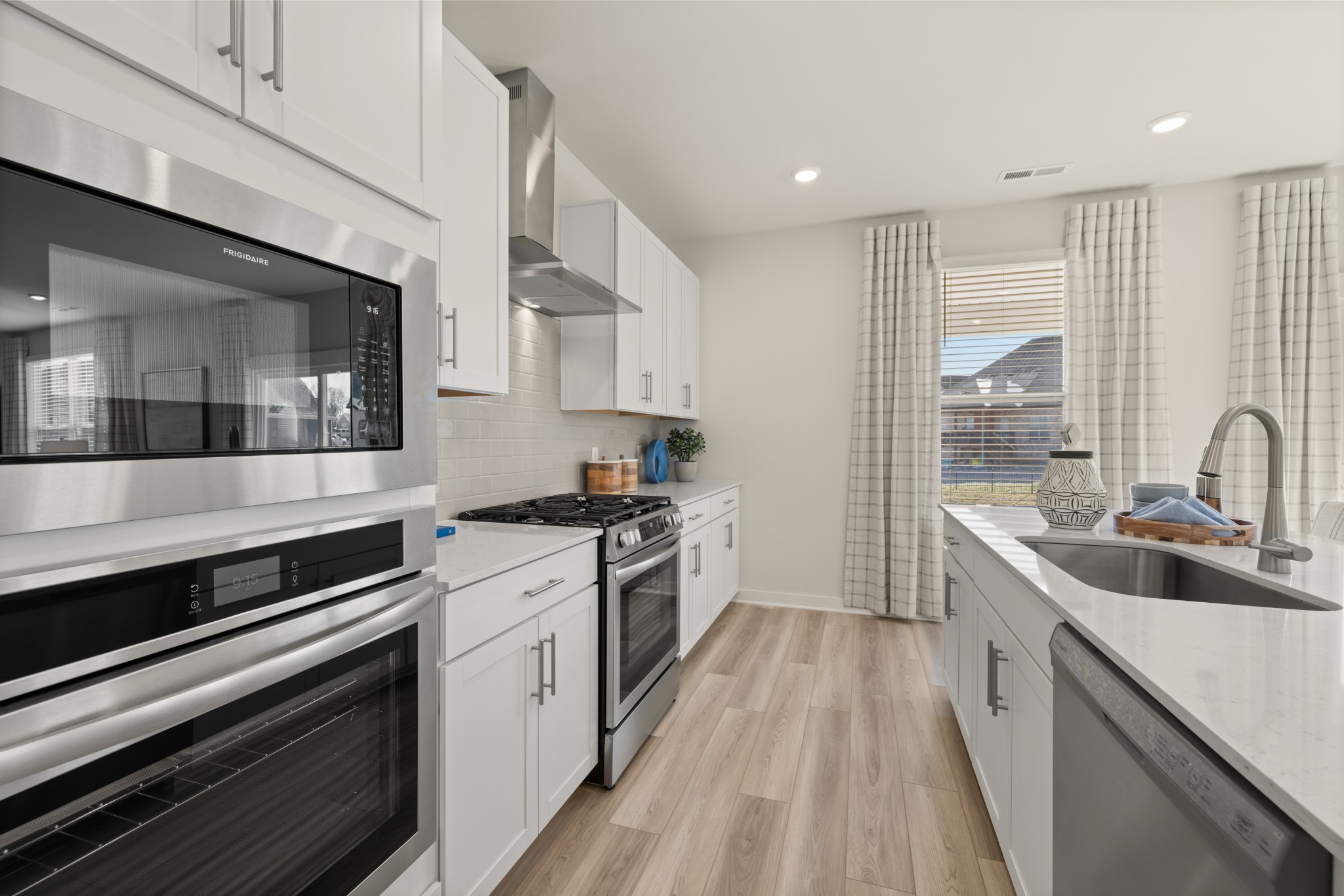 6364 North New Hope Road Hermitage, TN 37076 - Photo 11 of 56 a large kitchen with a stove and a sink