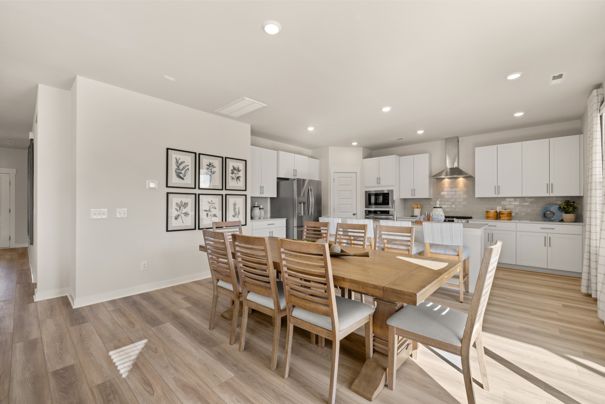 6364 North New Hope Road Hermitage, TN 37076 - Photo 16 of 56 a view of a dining room with furniture and wooden floor