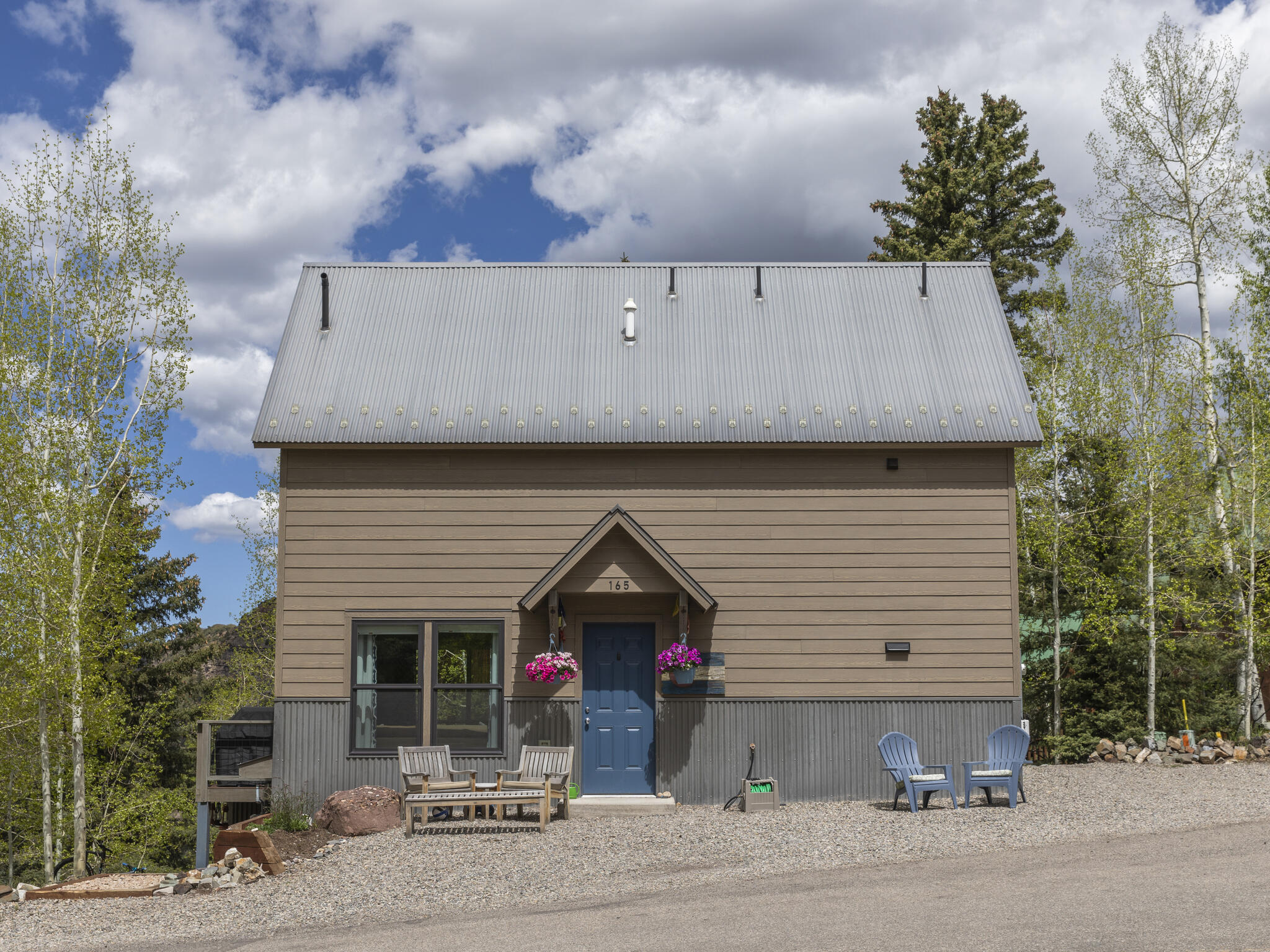 165 Alexander Overlook Telluride, CO 81435 - Photo 22 of 27 a front view of a house with a garage