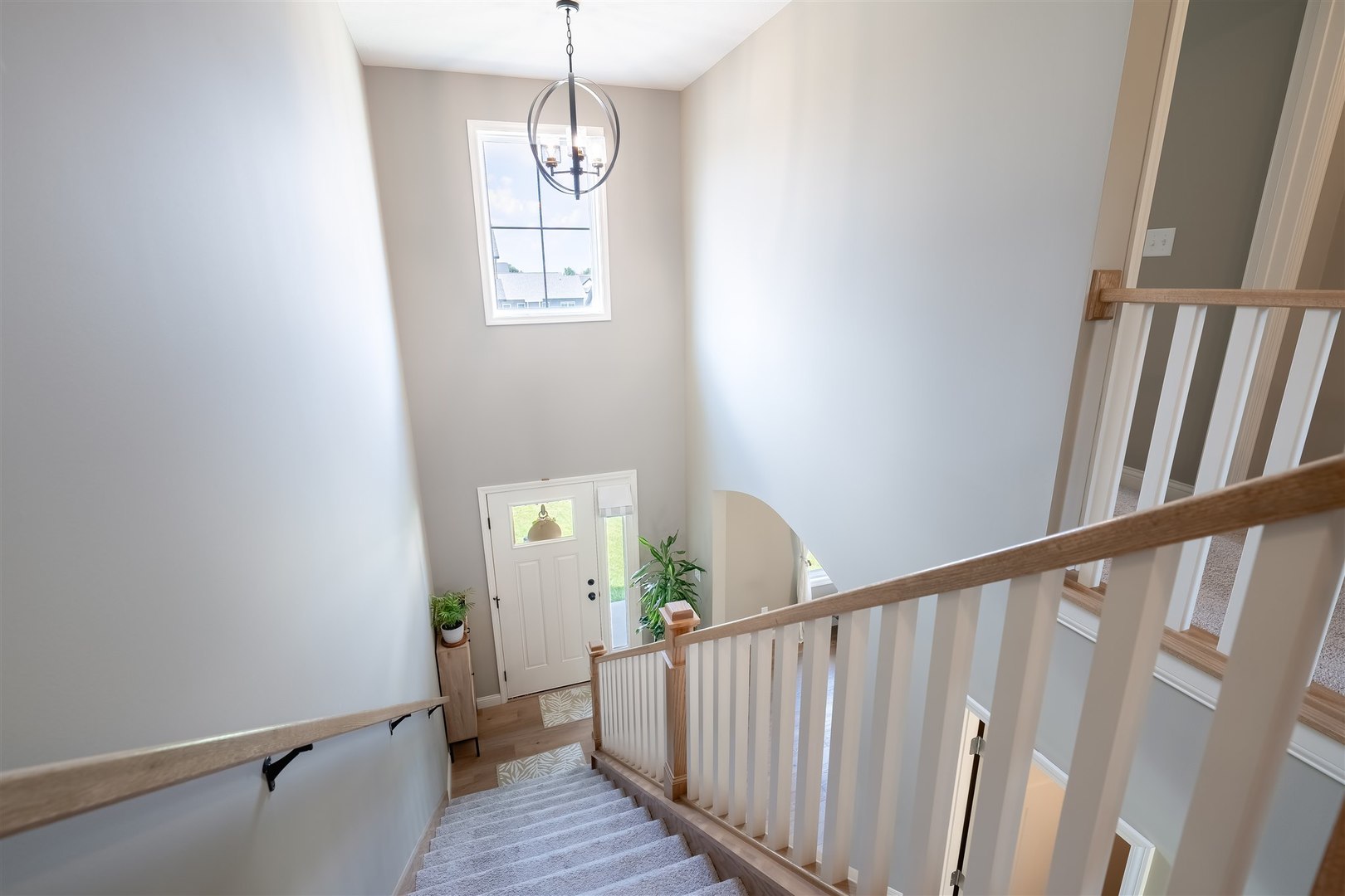 2512 Savanna Road Bloomington, IL 61705 - Photo 25 of 31 a view of a hallway with wooden floor and staircase