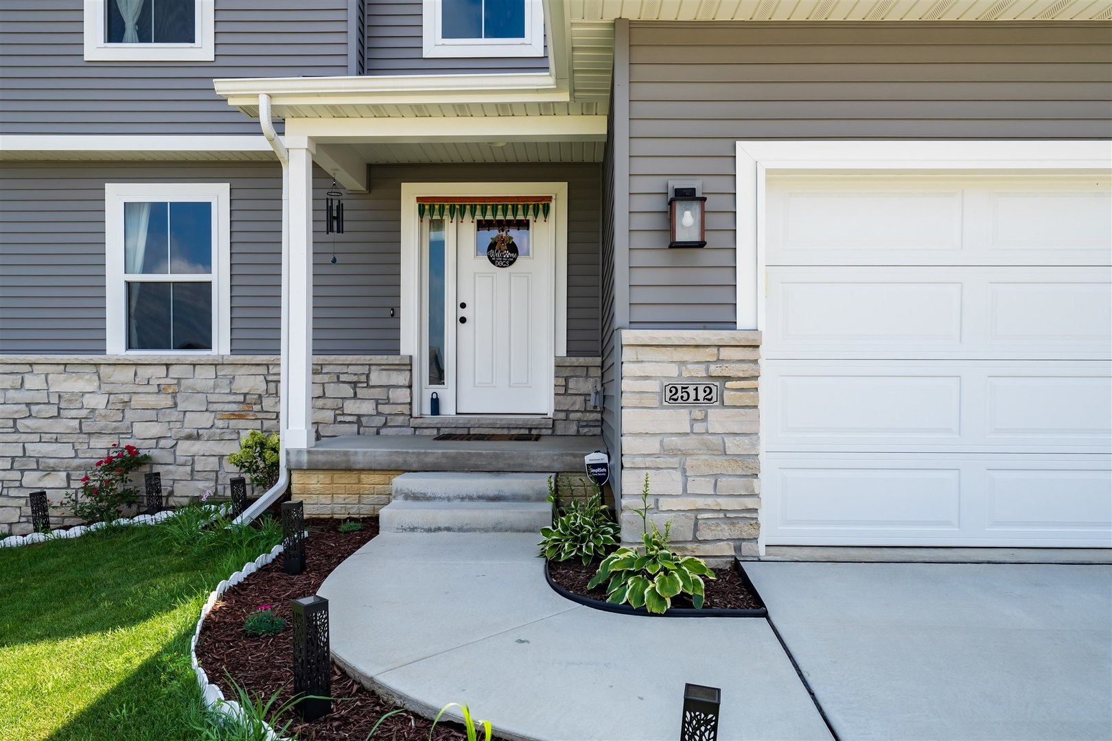 2512 Savanna Road Bloomington, IL 61705 - Photo 3 of 31 a view of a house with a small garden