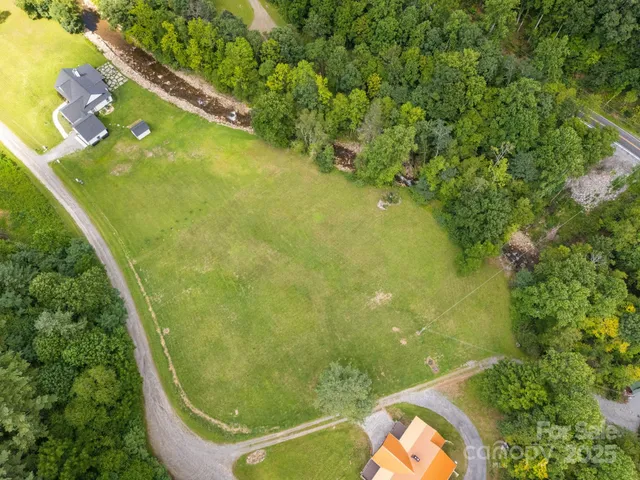 a view of a swimming pool with a garden