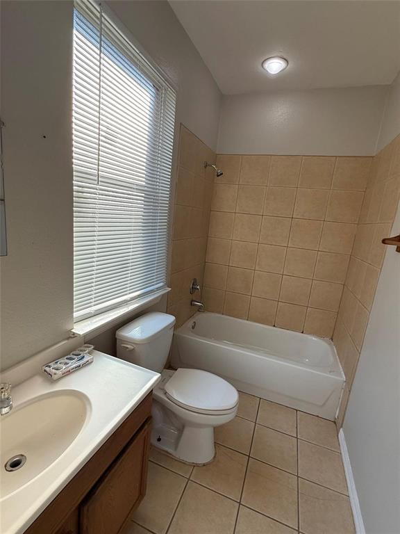1823 Smoke Tree Lane Dallas, TX 75253 - Photo 12 of 13 a bathroom with a sink a toilet a tub and shower
