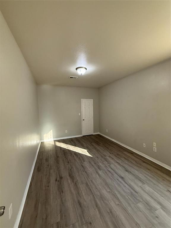 1823 Smoke Tree Lane Dallas, TX 75253 - Photo 4 of 13 a view of empty room with wooden floor