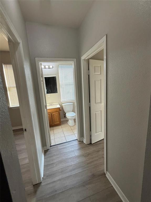 1823 Smoke Tree Lane Dallas, TX 75253 - Photo 8 of 13 a view of a livingroom from a hallway