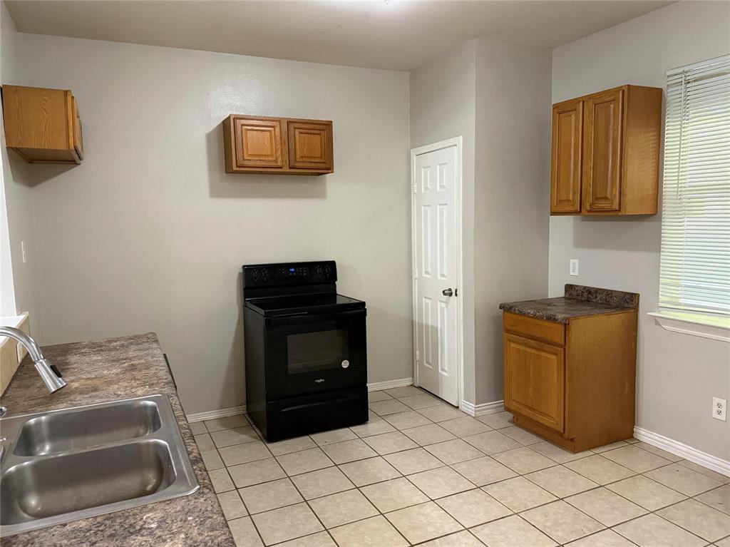 1823 Smoke Tree Lane Dallas, TX 75253 - Photo 10 of 13 a room with a bed and a couch