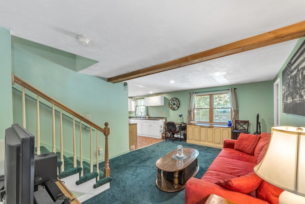 324 Central Avenue Dedham, MA 02026 - Photo 16 of 27 a living room with furniture and a wooden floor