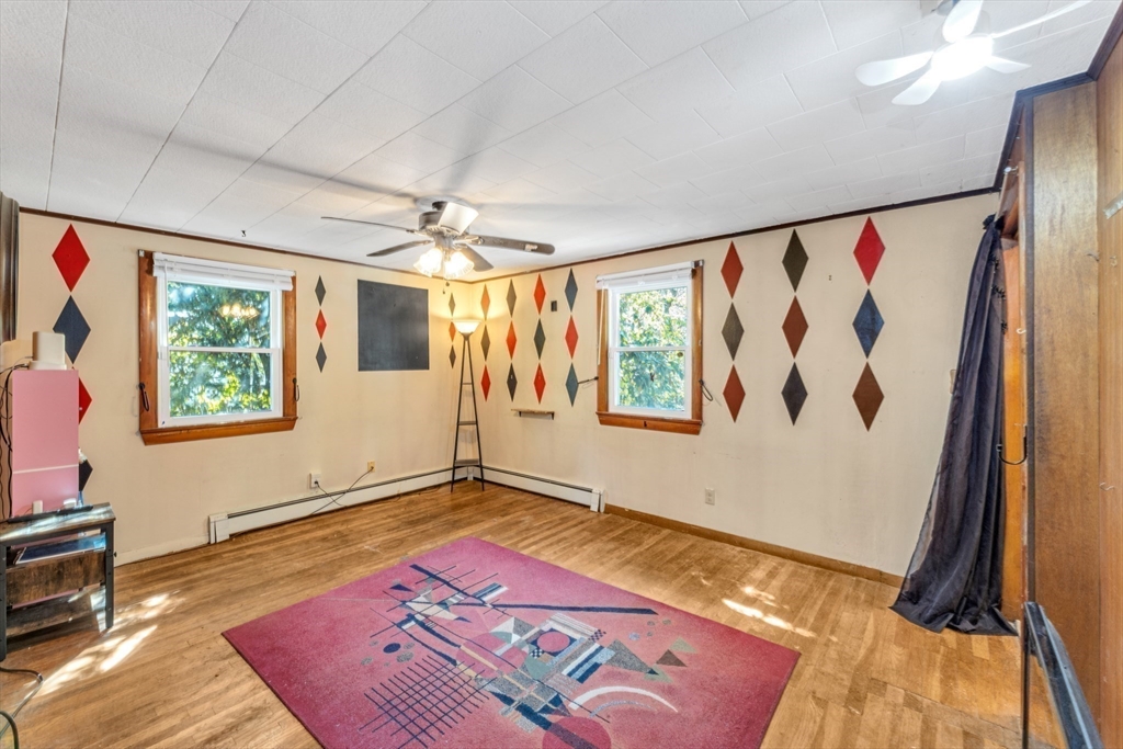 324 Central Avenue Dedham, MA 02026 - Photo 17 of 27 a view of an empty room and window