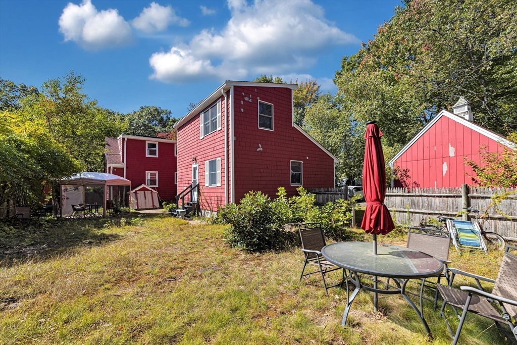 324 Central Avenue Dedham, MA 02026 - Photo 24 of 27 a view of a chairs with chandelier in front of house