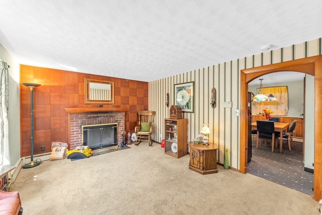 324 Central Avenue Dedham, MA 02026 - Photo 6 of 27 a view of livingroom with furniture and a fireplace