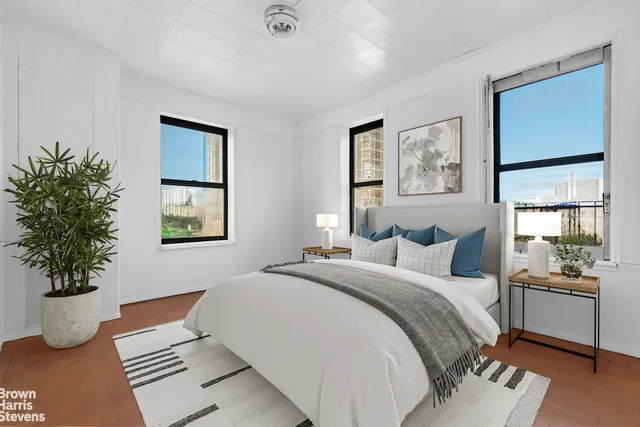 a bedroom with bed and window