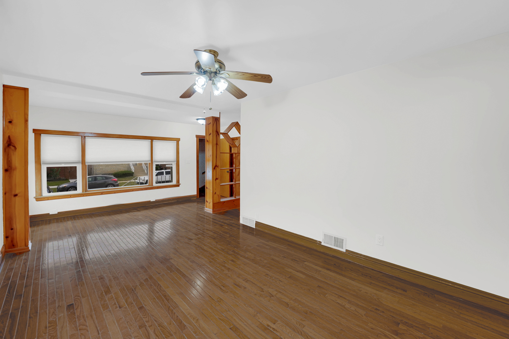 5535 South Kildare Avenue, Unit 1 Chicago, IL 60629 - Photo 17 of 23 a view of an empty room with a window and wooden floor