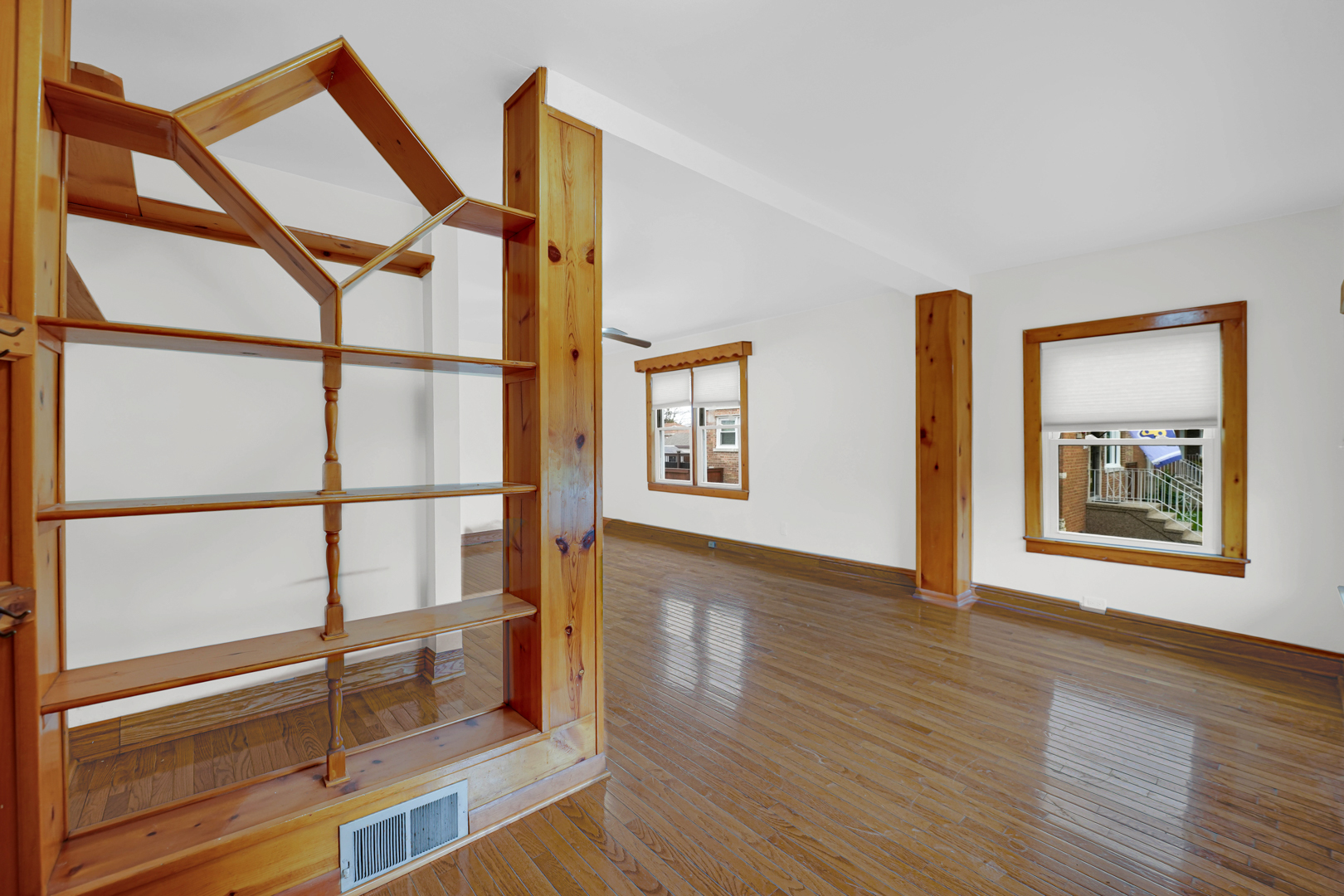 5535 South Kildare Avenue, Unit 1 Chicago, IL 60629 - Photo 20 of 23 a view of an empty room with wooden floor and a window