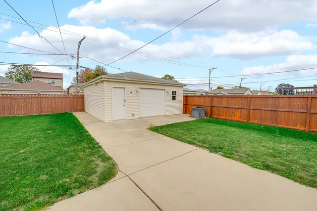 a view of a backyard with sitting area