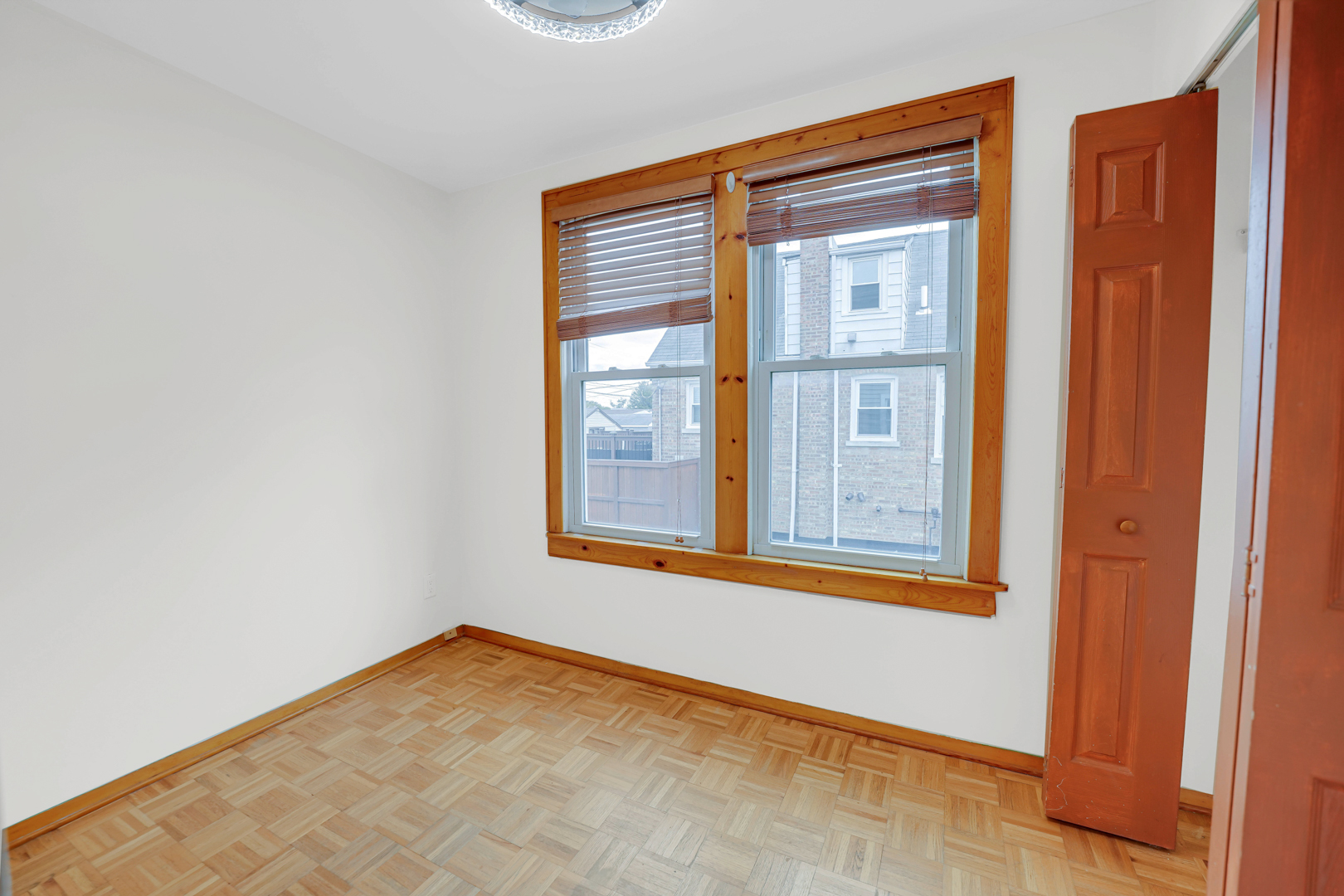 5535 South Kildare Avenue, Unit 1 Chicago, IL 60629 - Photo 8 of 23 a view of an empty room with a window