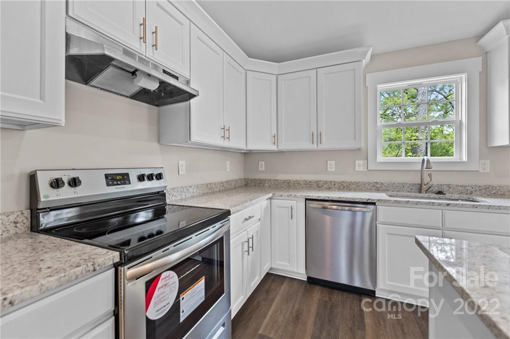 951 Pine Ridge Road, Unit 1 Chester, SC 29706 - Photo 19 of 31 a kitchen with stainless steel appliances granite countertop a stove and a sink