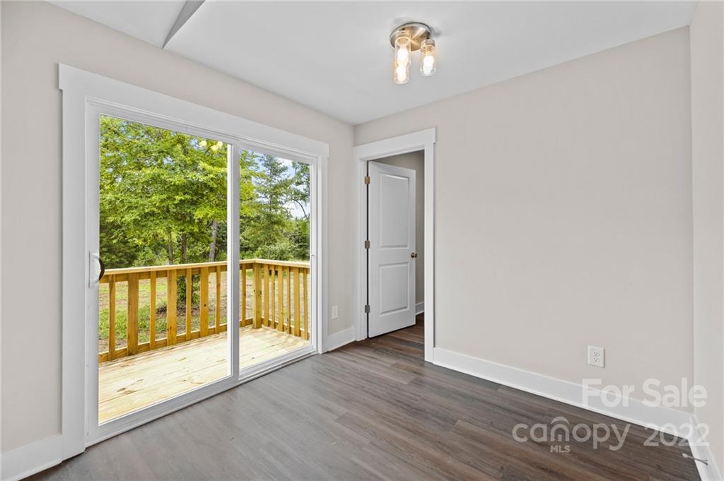 951 Pine Ridge Road, Unit 1 Chester, SC 29706 - Photo 25 of 31 an empty room with wooden floor and windows