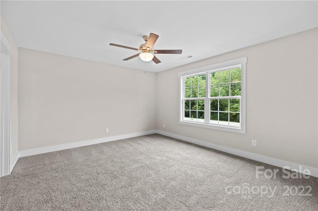 951 Pine Ridge Road, Unit 1 Chester, SC 29706 - Photo 28 of 31 an empty room with a window and a ceiling fan