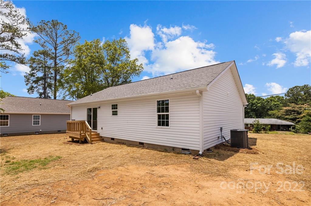 951 Pine Ridge Road, Unit 1 Chester, SC 29706 - Photo 6 of 31 a backyard of a house with table and chairs