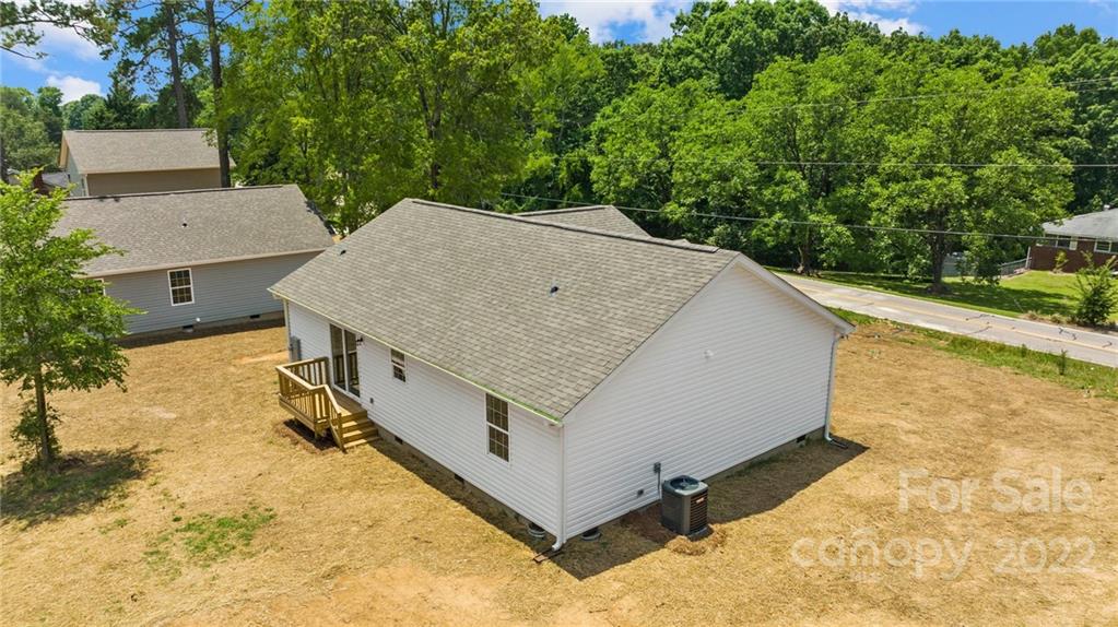 951 Pine Ridge Road, Unit 1 Chester, SC 29706 - Photo 10 of 31 an aerial view of a house with yard and trees in the background
