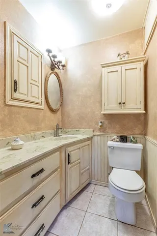 a bedroom with a bed and glass door