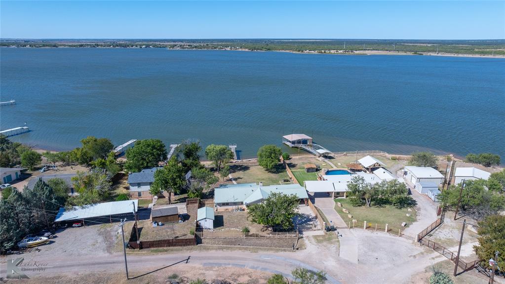 48 Poverty Point Circle Abilene, TX 79601 - Photo 2 of 35 an aerial view of a house with a garden and lake view