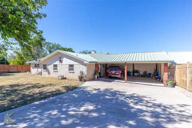 a view of a swimming pool with an outdoor seating