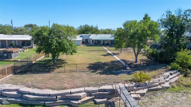 an aerial view of a house with lake view