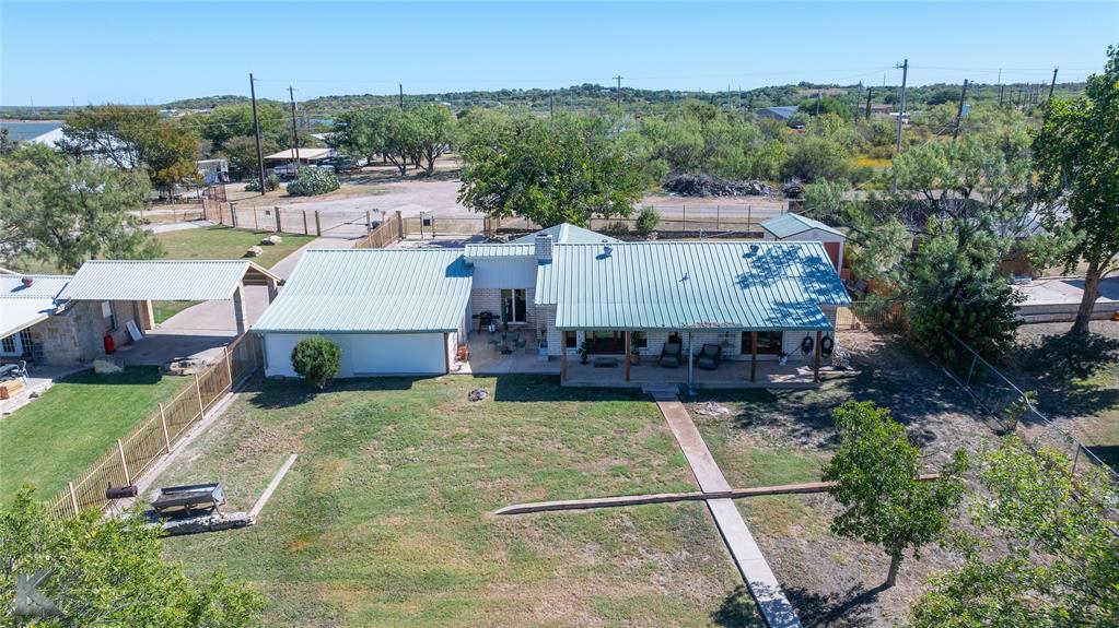 48 Poverty Point Circle Abilene, TX 79601 - Photo 33 of 35 an aerial view of a house with swimming pool garden and mountain view