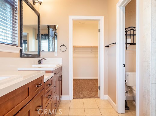 549 Palomar Circle Lompoc, CA 93436 - Photo 16 of 58 a spacious bathroom with a double vanity sink a mirror and a shower