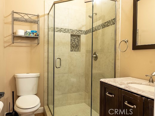 549 Palomar Circle Lompoc, CA 93436 - Photo 30 of 58 a bathroom with a granite countertop sink a toilet and shower