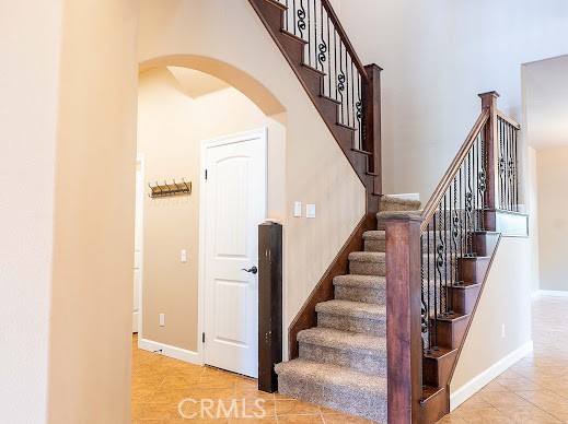 549 Palomar Circle Lompoc, CA 93436 - Photo 48 of 58 a view of staircase with lots of frames on wall and wooden floor