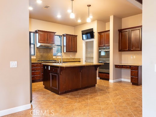549 Palomar Circle Lompoc, CA 93436 - Photo 54 of 58 a kitchen with stainless steel appliances granite countertop a refrigerator and a stove