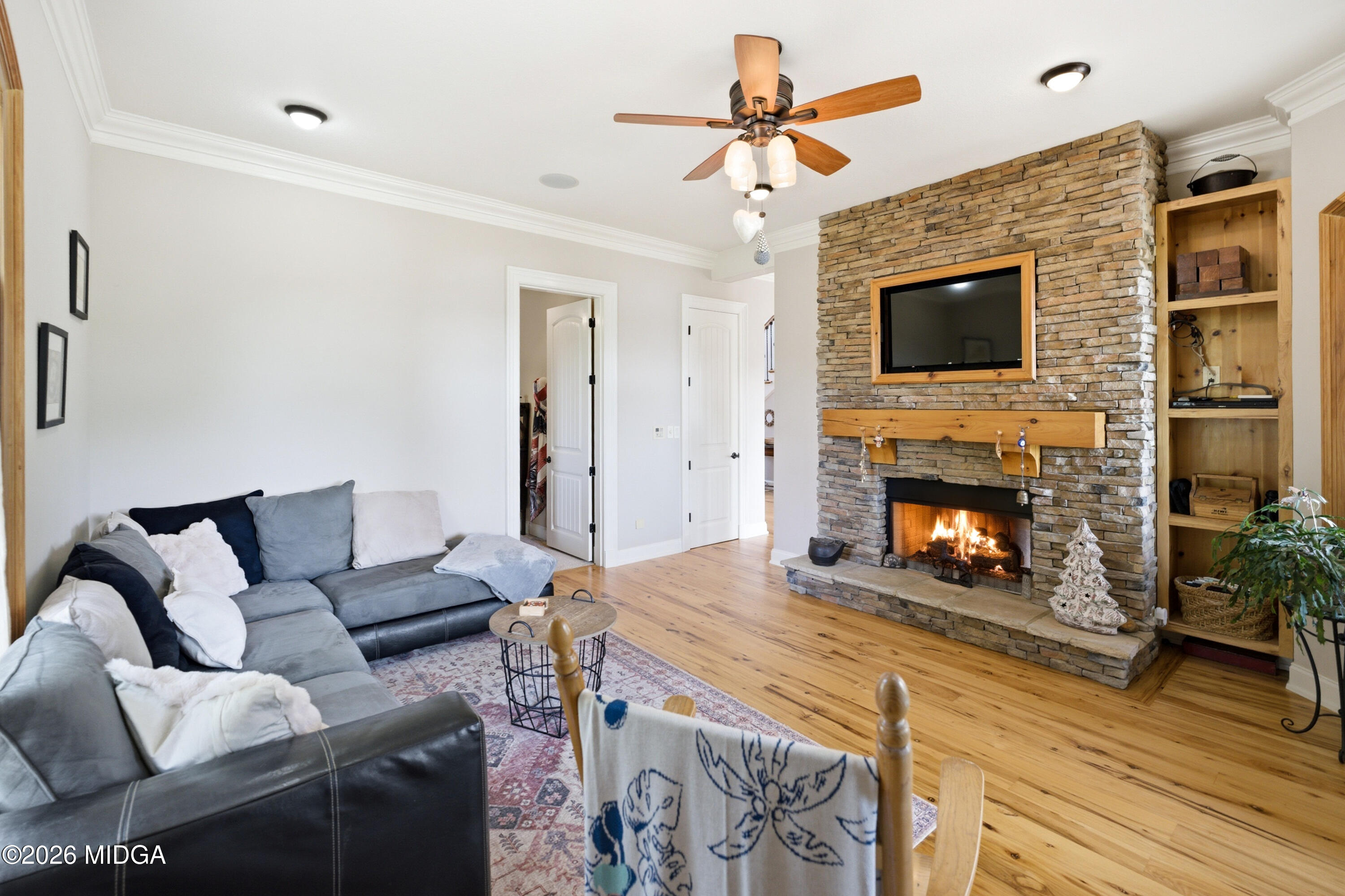 13 Southern Waters Way Forsyth, GA 31029 - Photo 27 of 112 a living room with furniture a flat screen tv and a fireplace