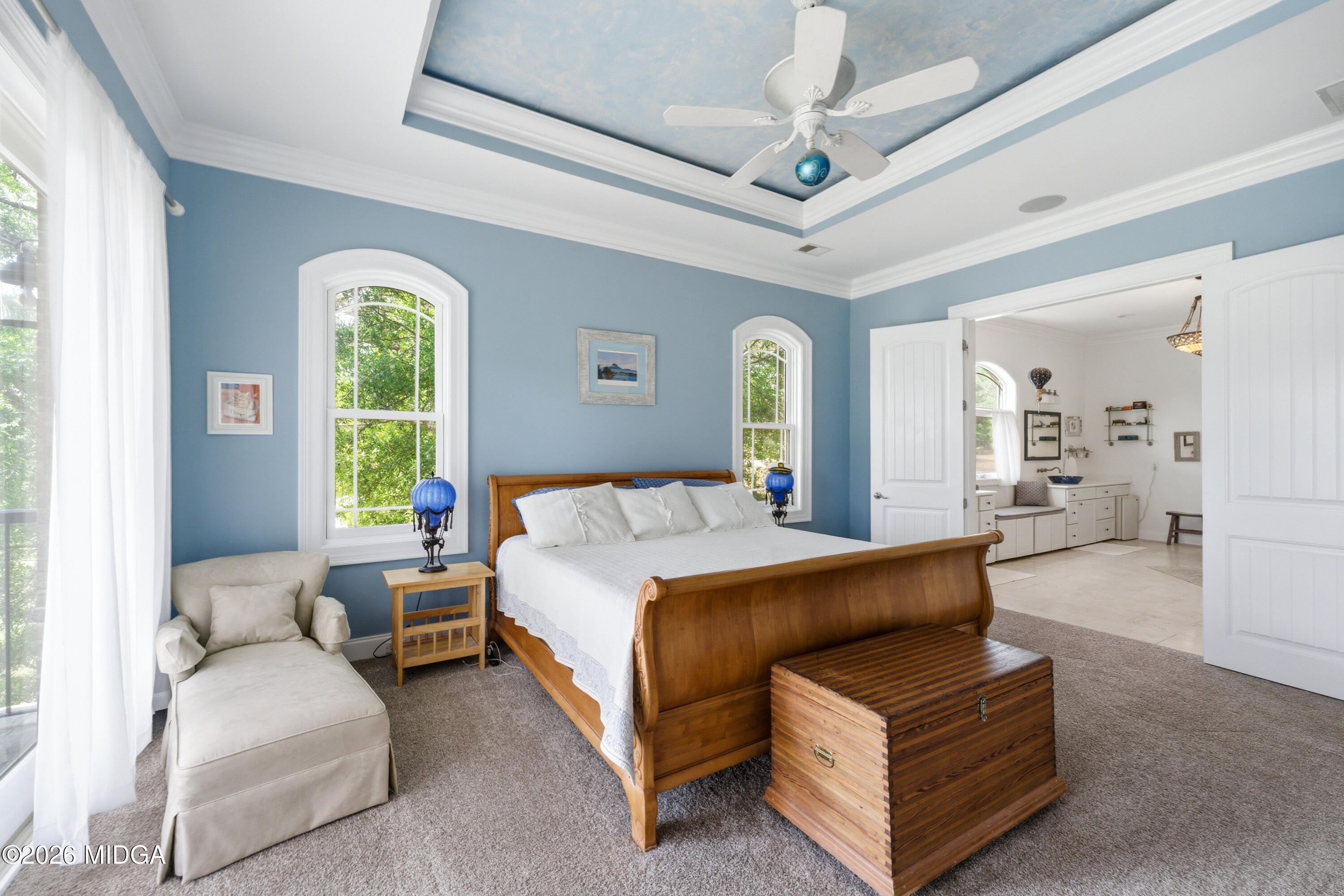 13 Southern Waters Way Forsyth, GA 31029 - Photo 38 of 112 a spacious bedroom with a bed a couch and a large window