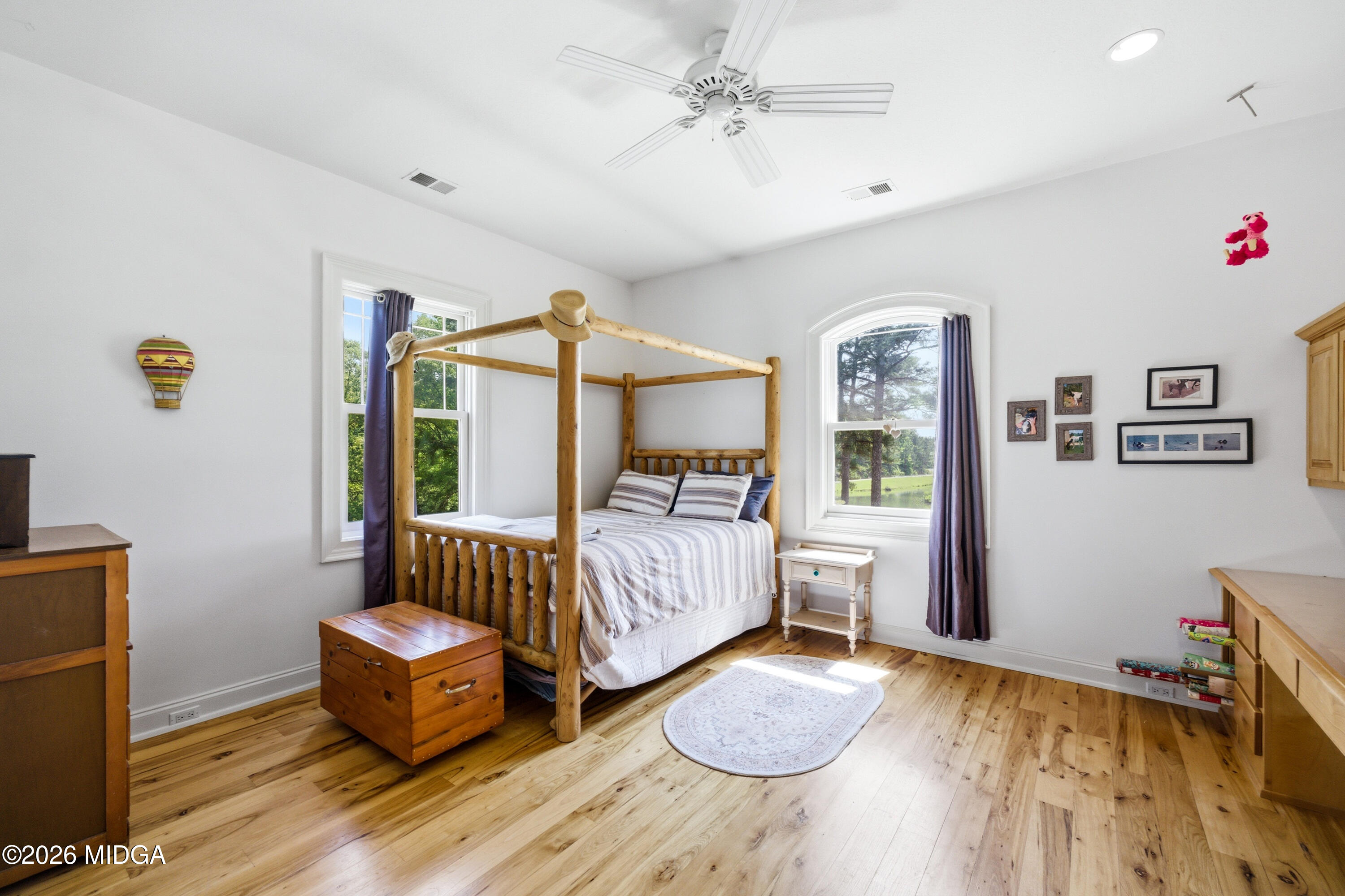 13 Southern Waters Way Forsyth, GA 31029 - Photo 48 of 112 a spacious bedroom with a bed and a table