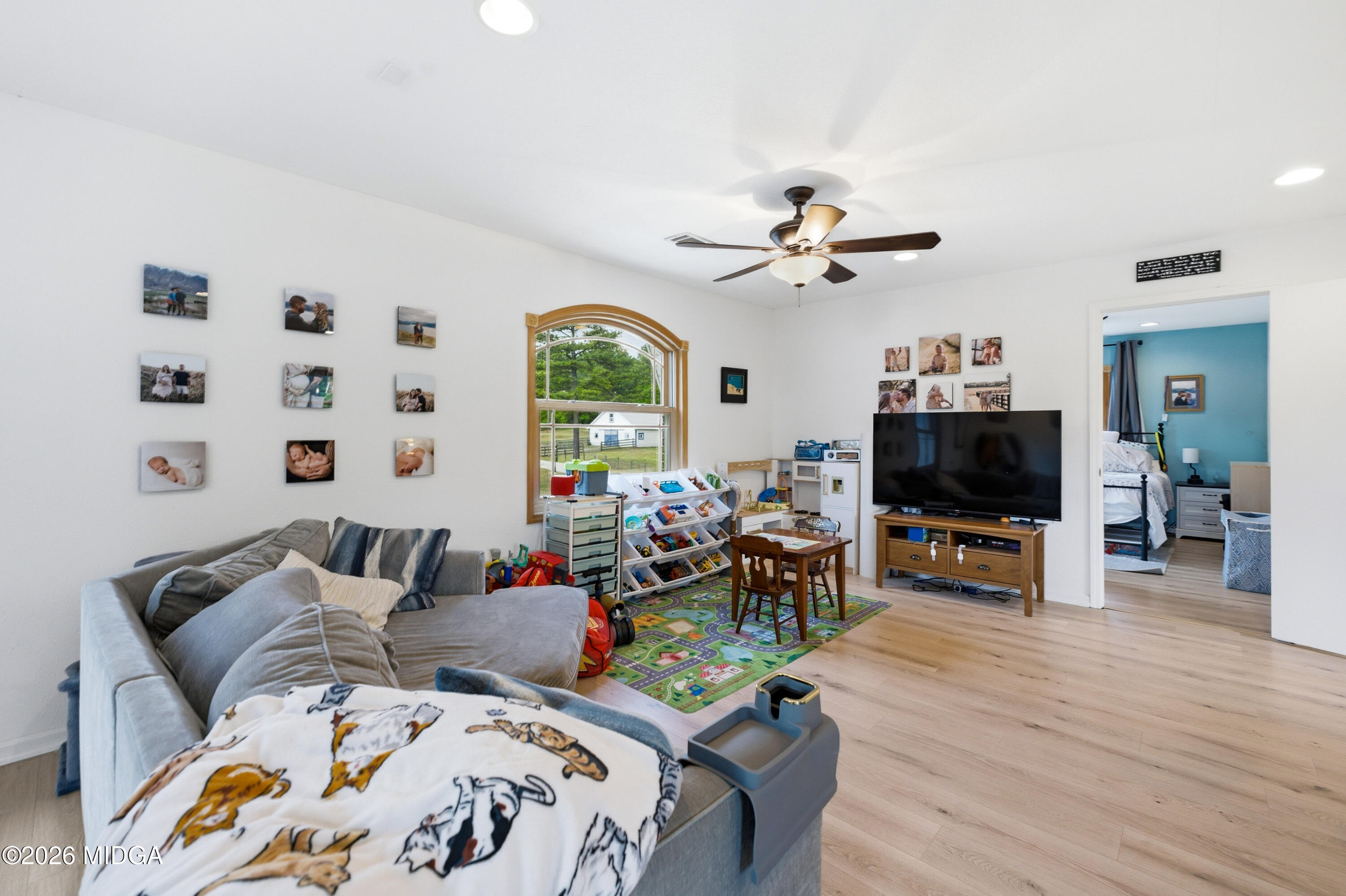 13 Southern Waters Way Forsyth, GA 31029 - Photo 70 of 112 a living room with furniture and a flat screen tv