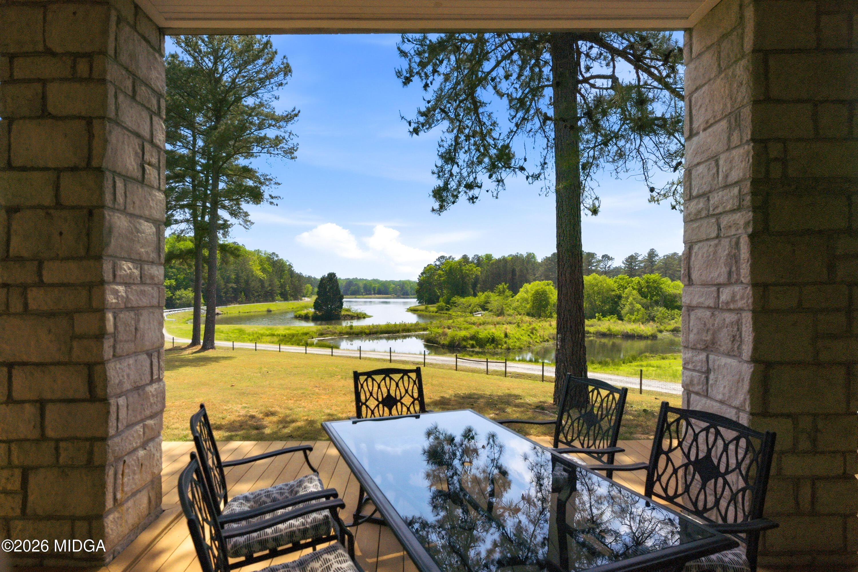 13 Southern Waters Way Forsyth, GA 31029 - Photo 85 of 112 a view of a lake with couches in patio