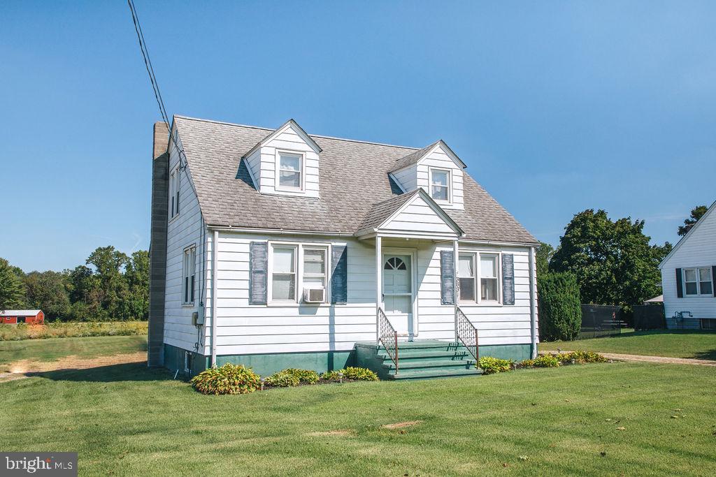 383 Elk Road Monroeville, NJ 08343 - Photo 2 of 25 a front view of a house with a garden