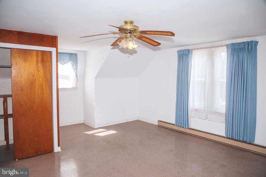 383 Elk Road Monroeville, NJ 08343 - Photo 13 of 25 wooden floor in an empty room with a window