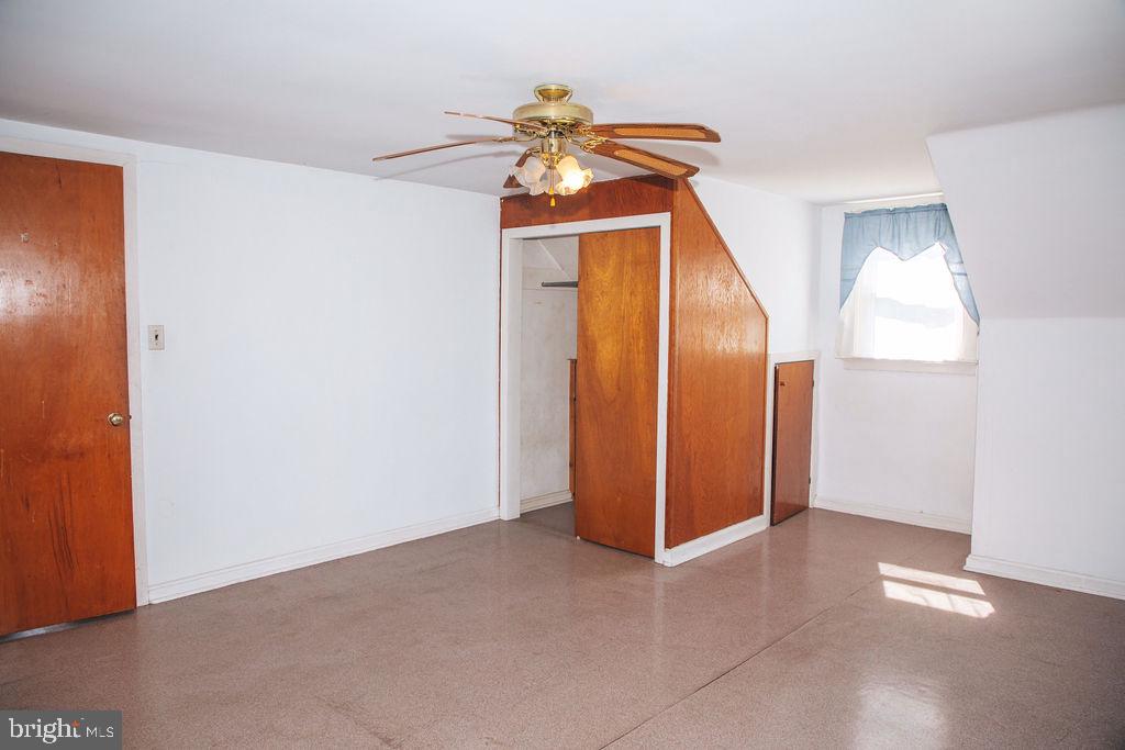 383 Elk Road Monroeville, NJ 08343 - Photo 14 of 25 an empty room with closet and a chandelier fan