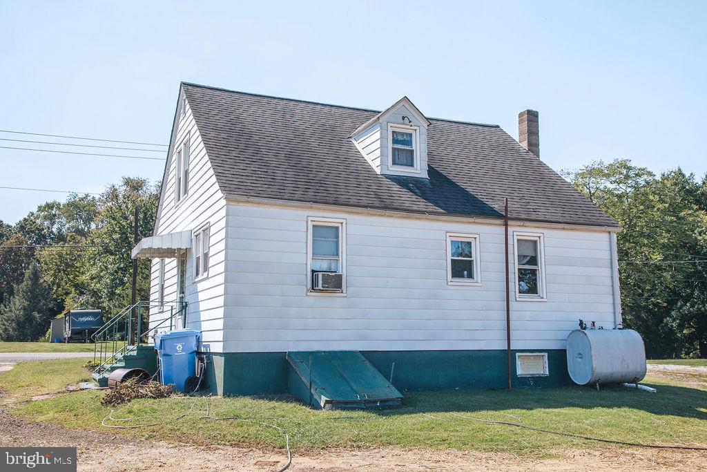 383 Elk Road Monroeville, NJ 08343 - Photo 16 of 25 a front view of a house with garden