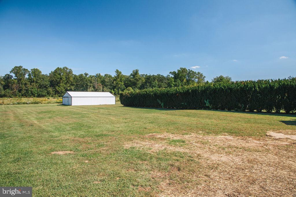 383 Elk Road Monroeville, NJ 08343 - Photo 19 of 25 a view of a golf course with a lake