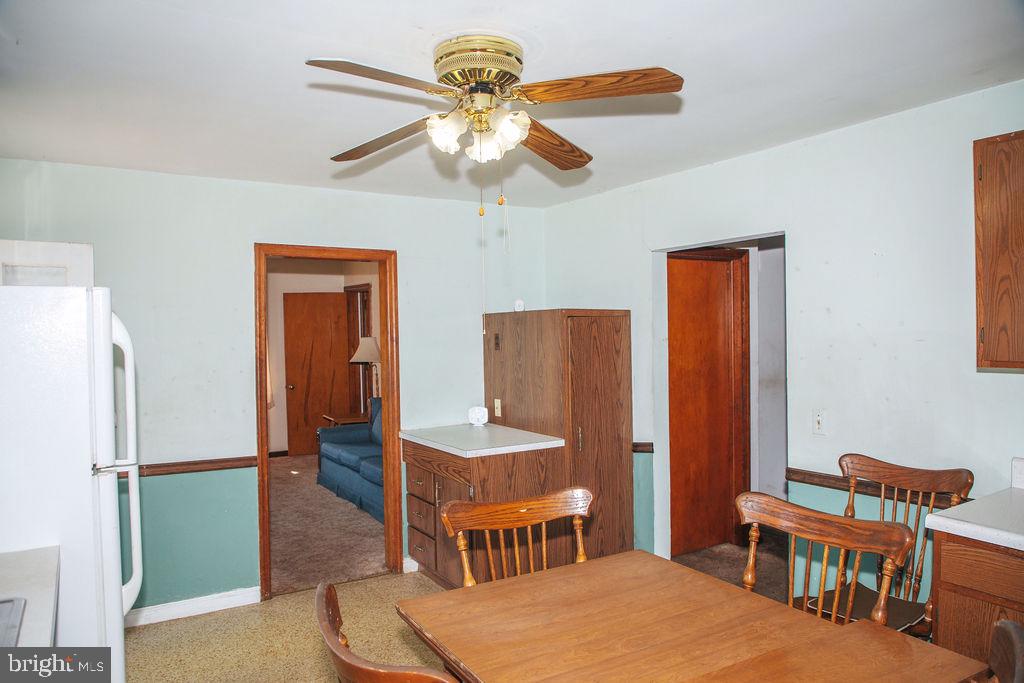 383 Elk Road Monroeville, NJ 08343 - Photo 4 of 25 a bedroom with furniture and a chandelier