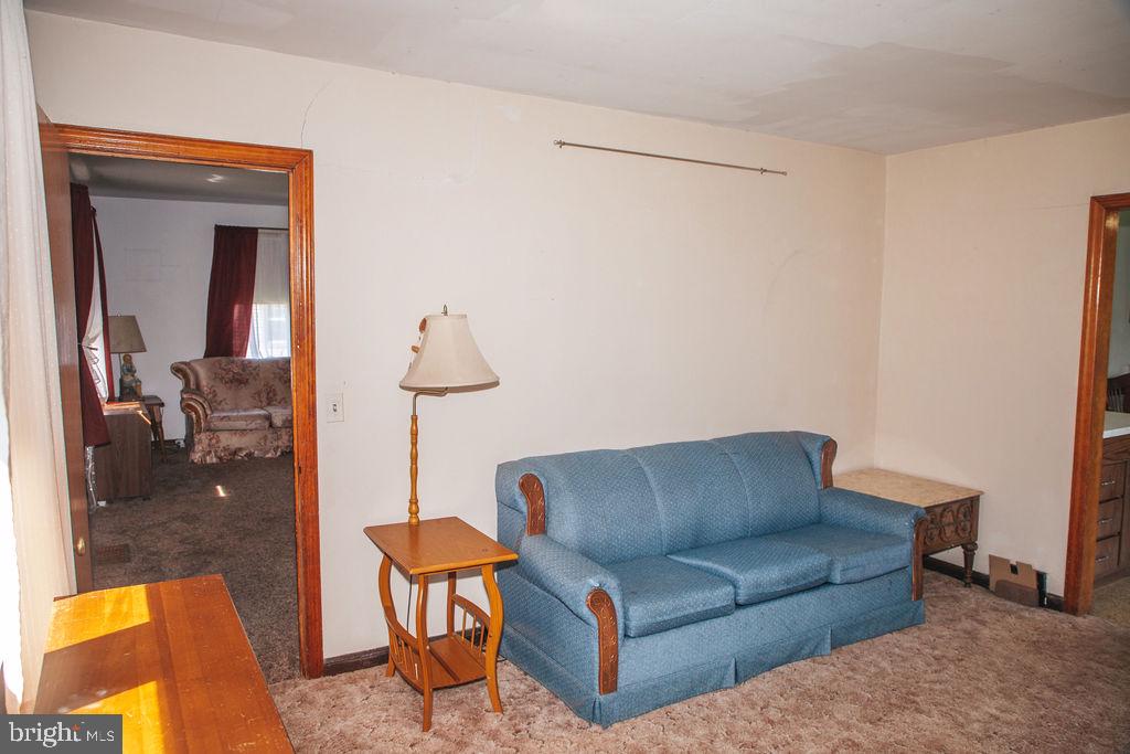 383 Elk Road Monroeville, NJ 08343 - Photo 6 of 25 a living room with furniture and a lamp